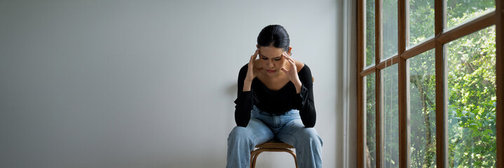 Depressed young Asian woman with mental health problem in mind need uttermost treatment from overthinking fatigue, disruptive thought, dissocial, anxiety and other mental health disorders .