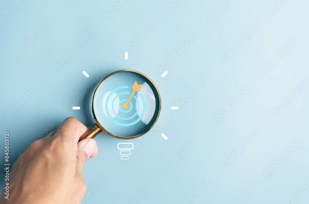Aufkleber Magnifying glass focus to target objective with idea creative light bulb icon. planning strategy development leadership and customer target group concept.