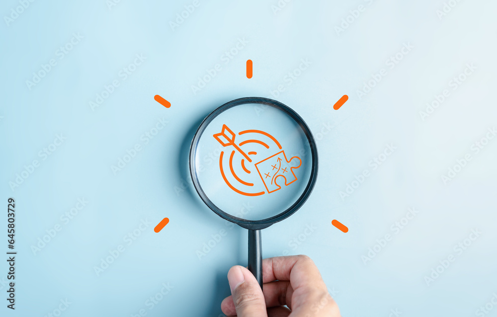 Aufkleber Magnifying glass focus to target objective with idea creative light bulb icon. planning strategy development leadership and customer target group concept.