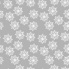 Seamless pattern of winter snowflakes on a gray background