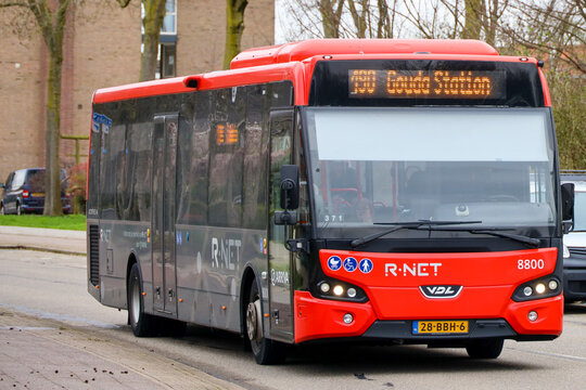 Red and black bus of Arriva between Gouda and Rotterdam in Nieuwerkerk