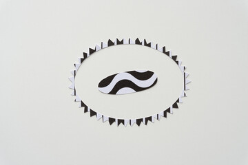 machine-cut starburst frame and elongated oval with waves on blank paper