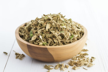 Dried Oregano spice in a wooden bowl side view