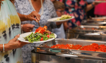 hand delicately savoring food, representing the joy and sensory pleasure of culinary indulgence