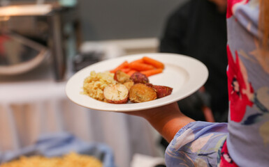 hand delicately savoring food, representing the joy and sensory pleasure of culinary indulgence