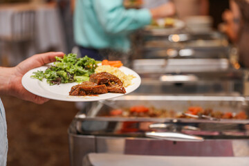 hand delicately savoring food, representing the joy and sensory pleasure of culinary indulgence