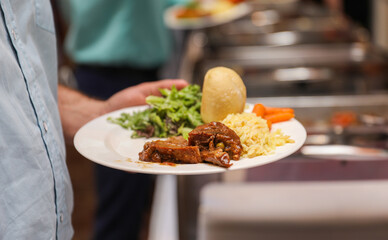 hand delicately savoring food, representing the joy and sensory pleasure of culinary indulgence
