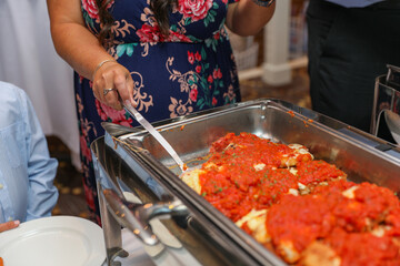 hand delicately savoring food, representing the joy and sensory pleasure of culinary indulgence