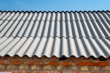 Roof structure. Slate roof, gray slate sheets. Construction of a house