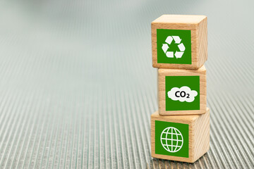 Global Co2 reduction targets, renewable energy sources, ecological support, environmental business concept, wooden blocks with eco symbols, copy space