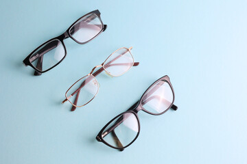 glasses for vision correction on a colored background with space for text