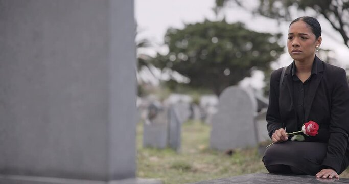 Sad woman, rose and graveyard in mourning, loss or grief at funeral, tombstone or cemetery. Female person with flower in depression, death or goodbye at memorial or burial service for loved one