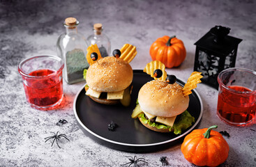 Meat burger in the form of funny monster for Halloween holiday