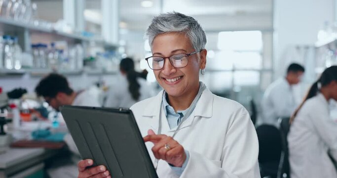 Senior woman, scientist and tablet in research, data analysis or results for new science discovery at laboratory. Mature female person, medical or healthcare worker on technology in scientific lab