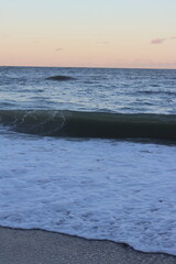 The coastal sunset over the ocean at Jacksonville Beach in Florida.