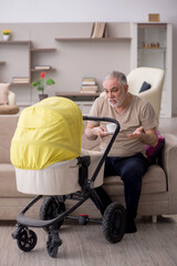 Old man looking after newborn at home