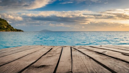Fototapeta na wymiar Wooden table with sea, island, and blue sky in the background
