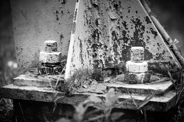 A high-voltage pole for electrical transmission is bolted to a concrete slab, Kyiv, Ukraine.