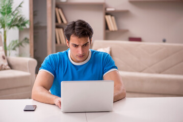 Young man freelancer working from home