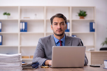 Young male employee working in the office