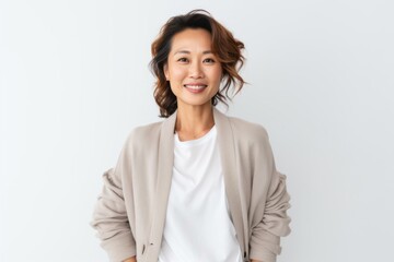 Fototapeta premium Portrait photography of a Vietnamese woman in her 40s against a white background