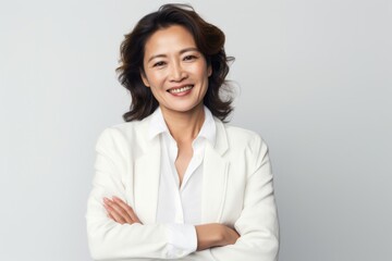 Group portrait photography of a Vietnamese woman in her 40s against a white background