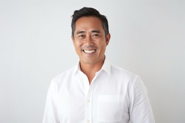 Medium shot portrait photography of a Vietnamese man in his 40s against a white background