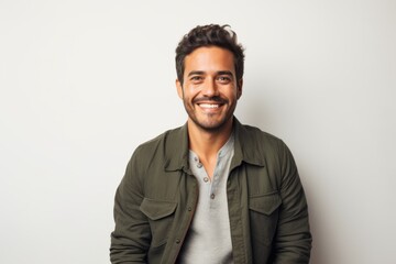Portrait photography of a Peruvian man in his 30s against a white background