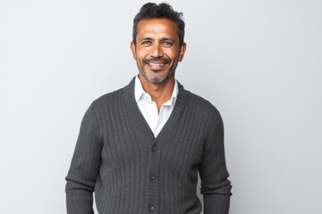 Portrait photography of a Peruvian man in his 40s against a white background
