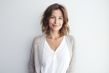 Fototapeta premium Lifestyle portrait photography of a French woman in her 30s against a white background