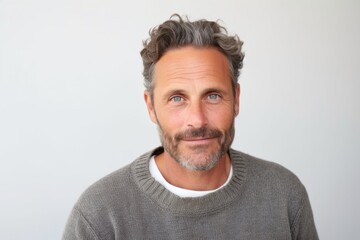 Medium shot portrait photography of a French man in his 40s against a white background