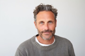 Fototapeta premium Medium shot portrait photography of a French man in his 40s against a white background