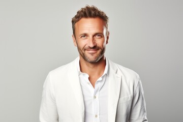 Portrait photography of a French man in his 40s against a white background