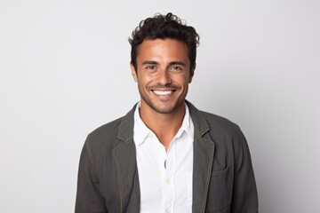 Medium shot portrait photography of a Colombian man in his 20s against a white background