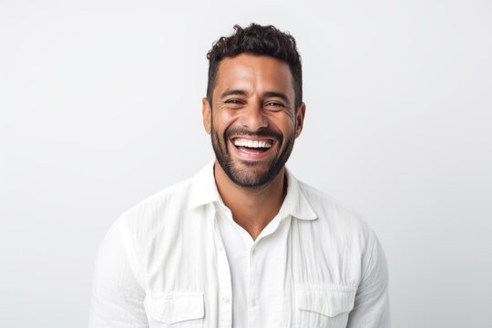 Medium shot portrait photography of a Colombian man in his 30s against a white background