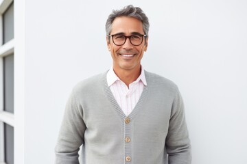 Portrait photography of a Colombian man in his 50s against a white background