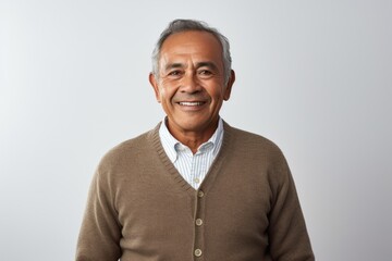 Fototapeta premium Portrait photography of a Colombian man in his 50s against a white background