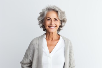 Medium shot portrait photography of a Italian woman in her 60s against a white background
