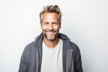 Fototapeta premium Lifestyle portrait photography of a Swedish man in his 40s against a white background