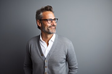 Lifestyle portrait photography of a French man in his 40s against a minimalist or empty room background