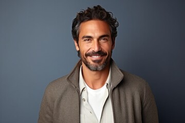 Fototapeta premium Medium shot portrait photography of a Colombian man in his 40s against a minimalist or empty room background