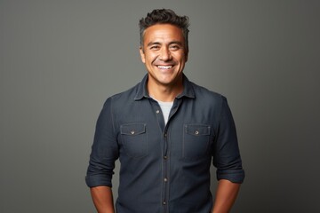 Lifestyle portrait photography of a Colombian man in his 40s against a minimalist or empty room background