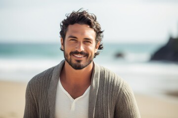 Portrait photography of a Colombian man in his 30s against a beach background