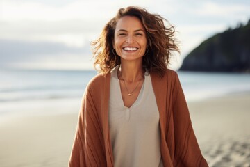 Portrait photography of a Colombian woman in her 40s against a beach background