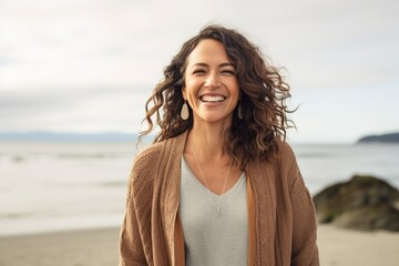 Portrait photography of a Colombian woman in her 40s against a beach background