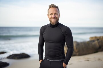 Medium shot portrait photography of a Swedish man in his 40s wearing a pair of leggings or tights against a beach background