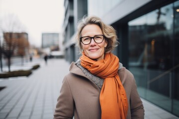Portrait photography of a Swedish woman in her 50s against a modern architectural background