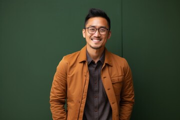 Portrait photography of a Vietnamese man in his 30s against an abstract background