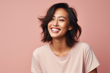 Fototapeta premium Close-up portrait photography of a Vietnamese woman in her 30s wearing knee-length shorts against a pastel or soft colors background