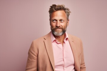 Fototapeta premium Medium shot portrait photography of a Swedish man in his 40s against a pastel or soft colors background